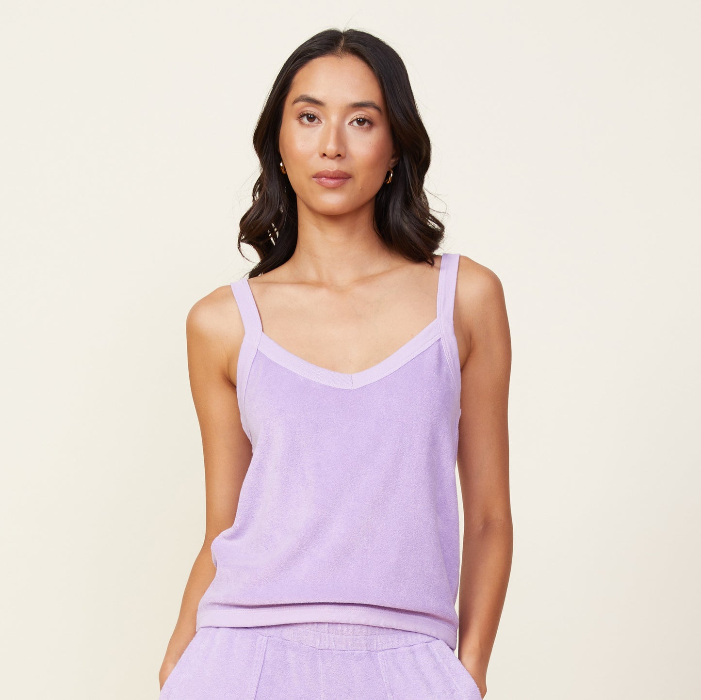 Front view of model wearing the terry cloth tank in lavendula.