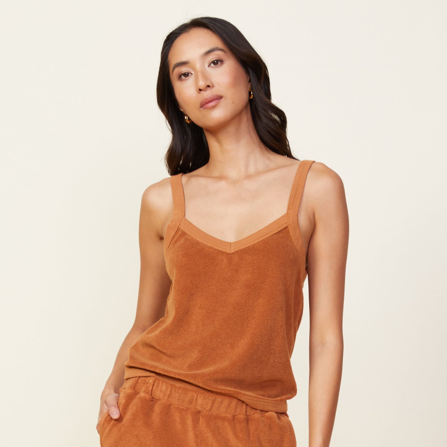 Front view of model wearing the terry cloth tank in coconut.