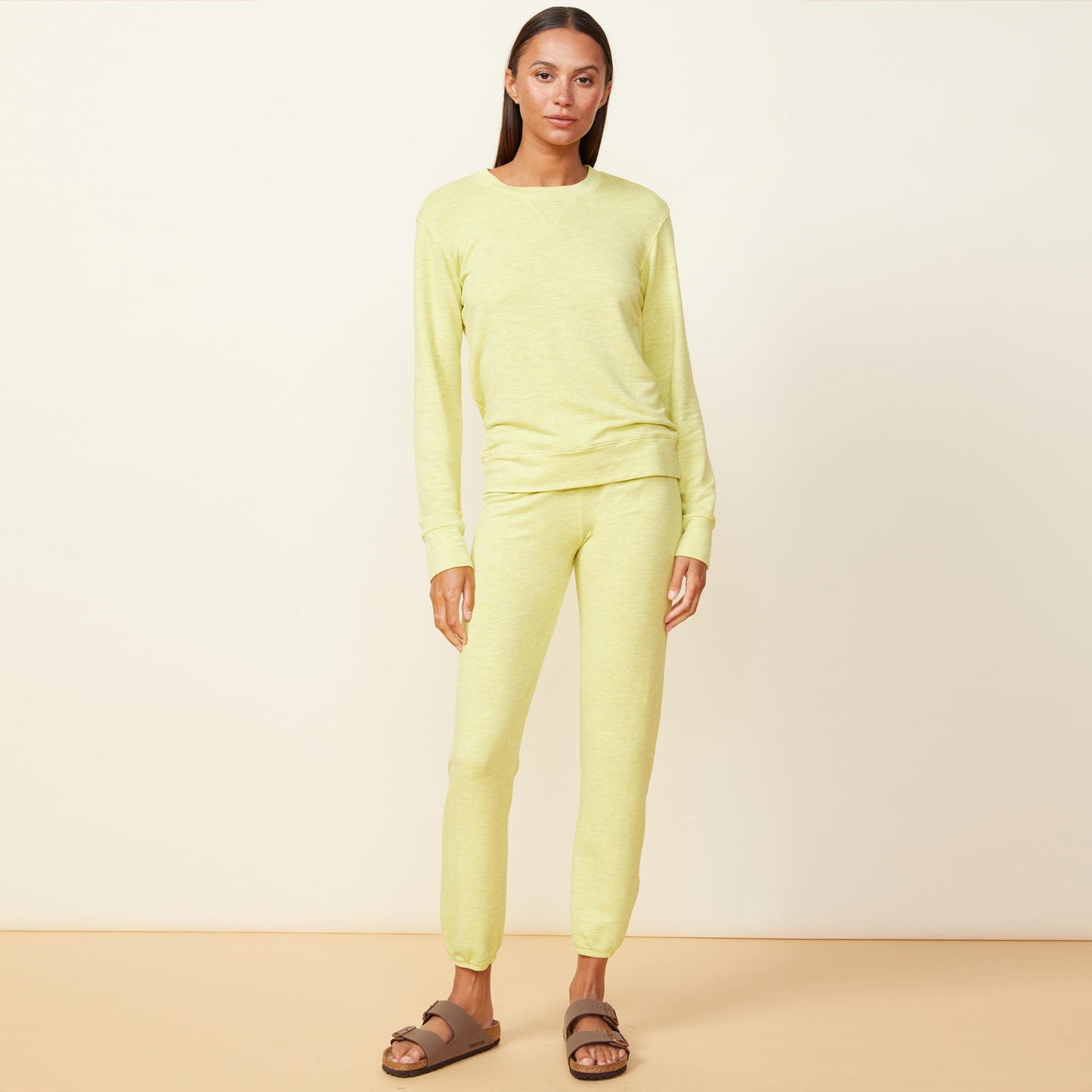 Front view of model wearing the supersoft crew neck sweatshirt in citron.