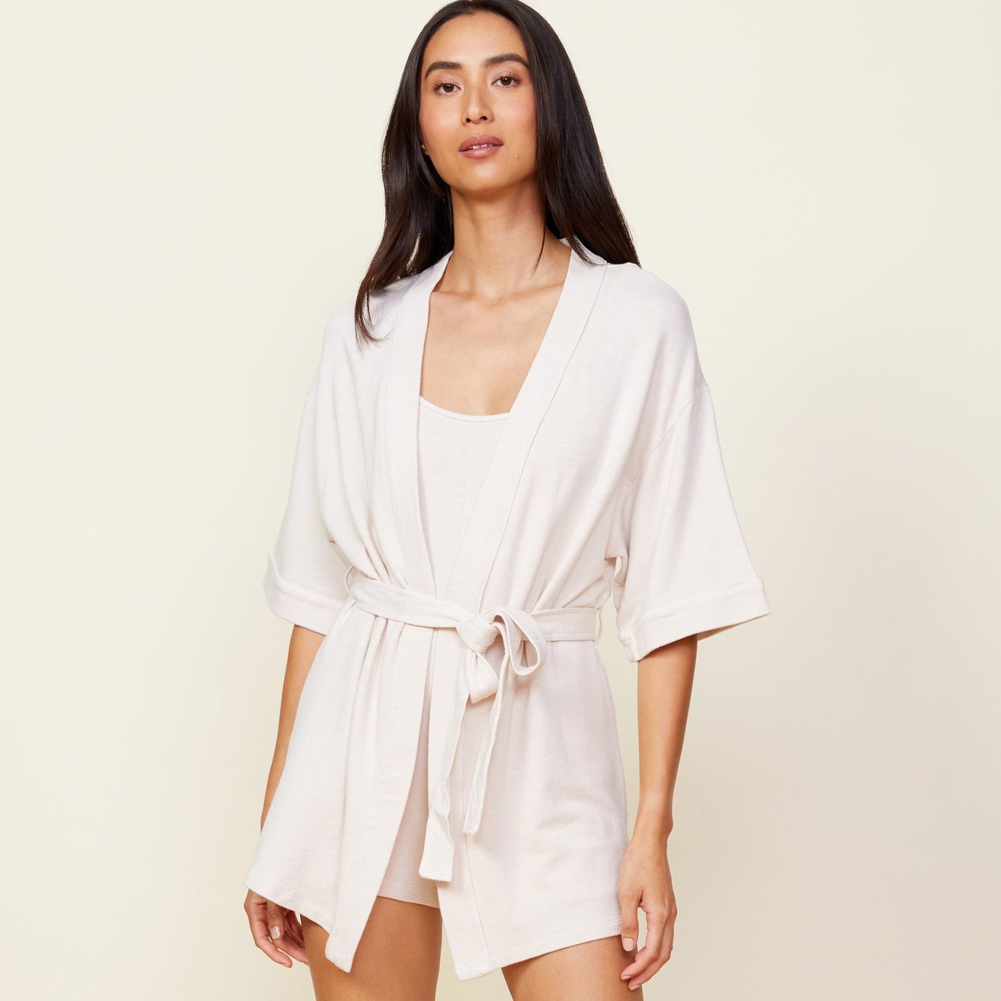 Front view of model wearing the supersoft robe in bone.