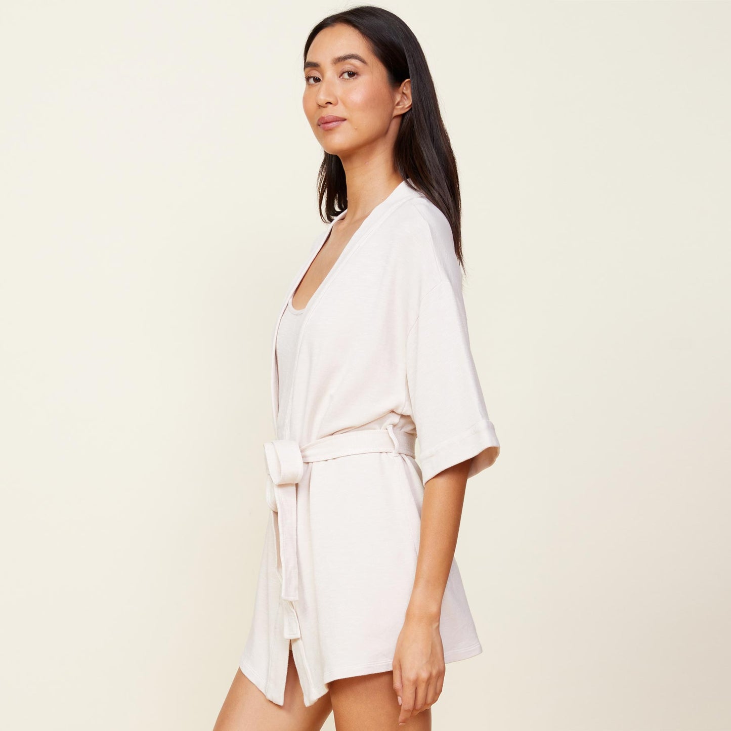 Side view of model wearing the supersoft robe in bone.