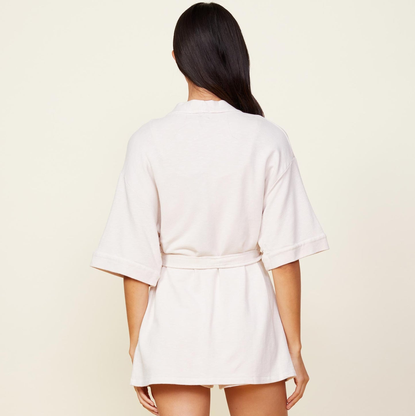 Back view of model wearing the supersoft robe in bone.