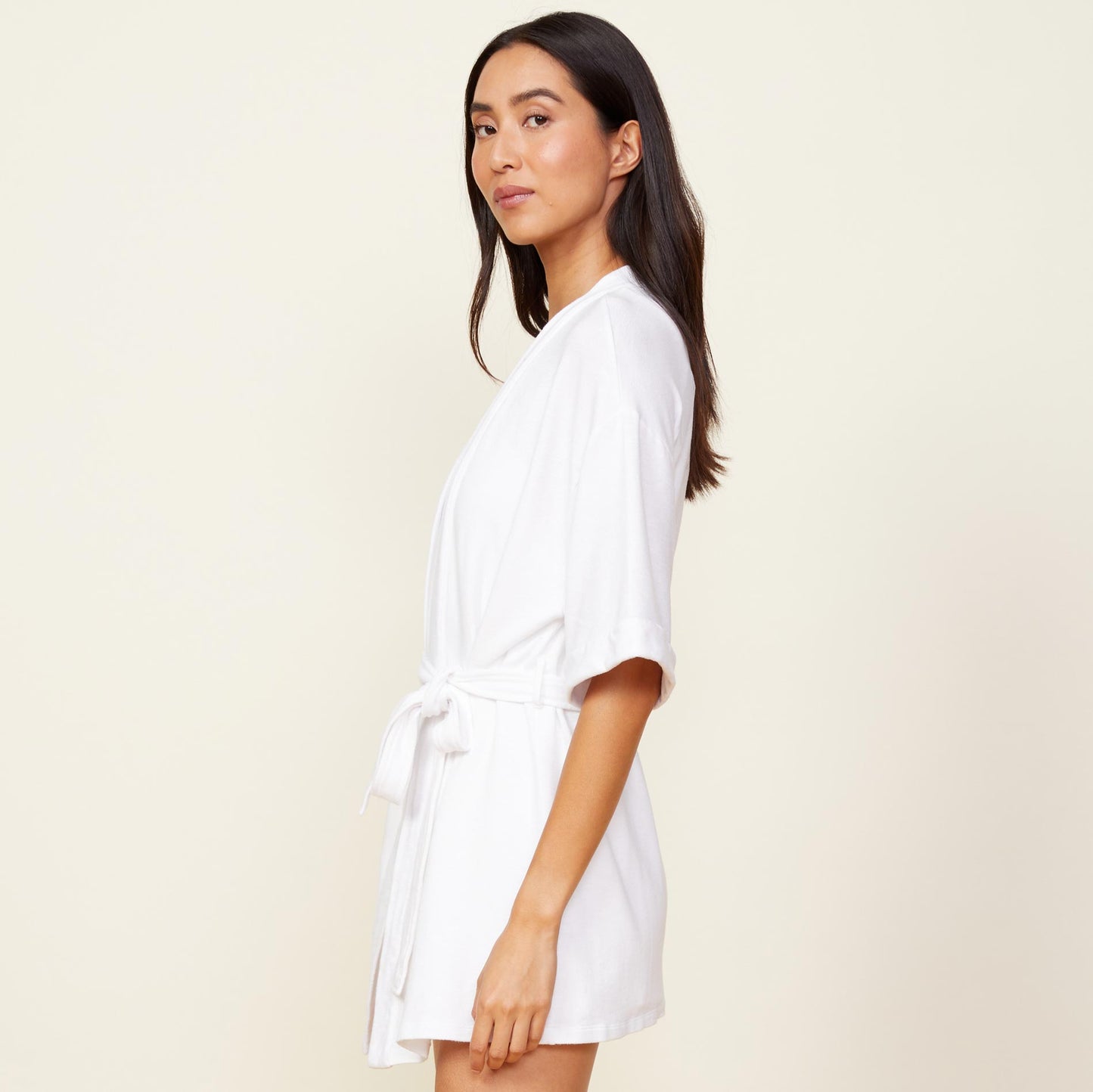Side view of model wearing the supersoft robe in white.