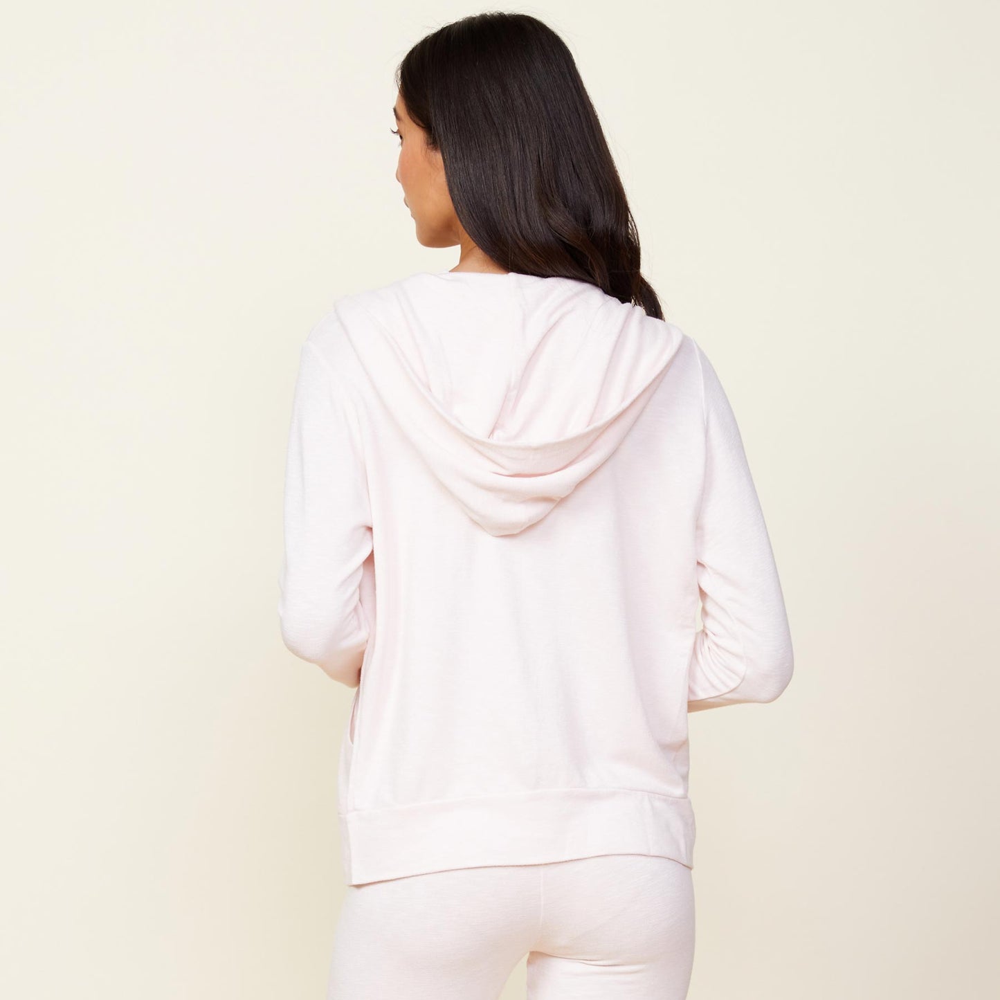 Back view of model wearing the supersoft zip up hoody in peony.