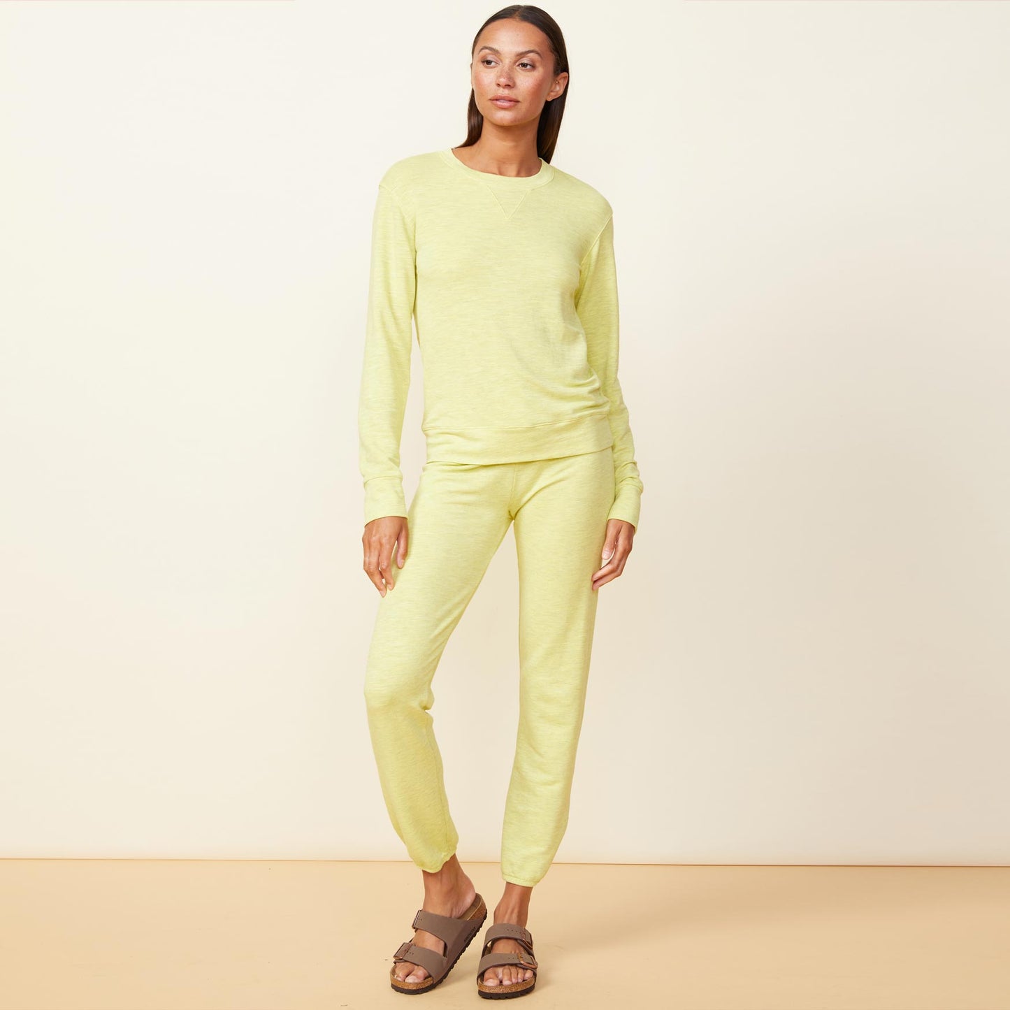 Front view of model wearing the supersoft crew neck sweatshirt in citron.