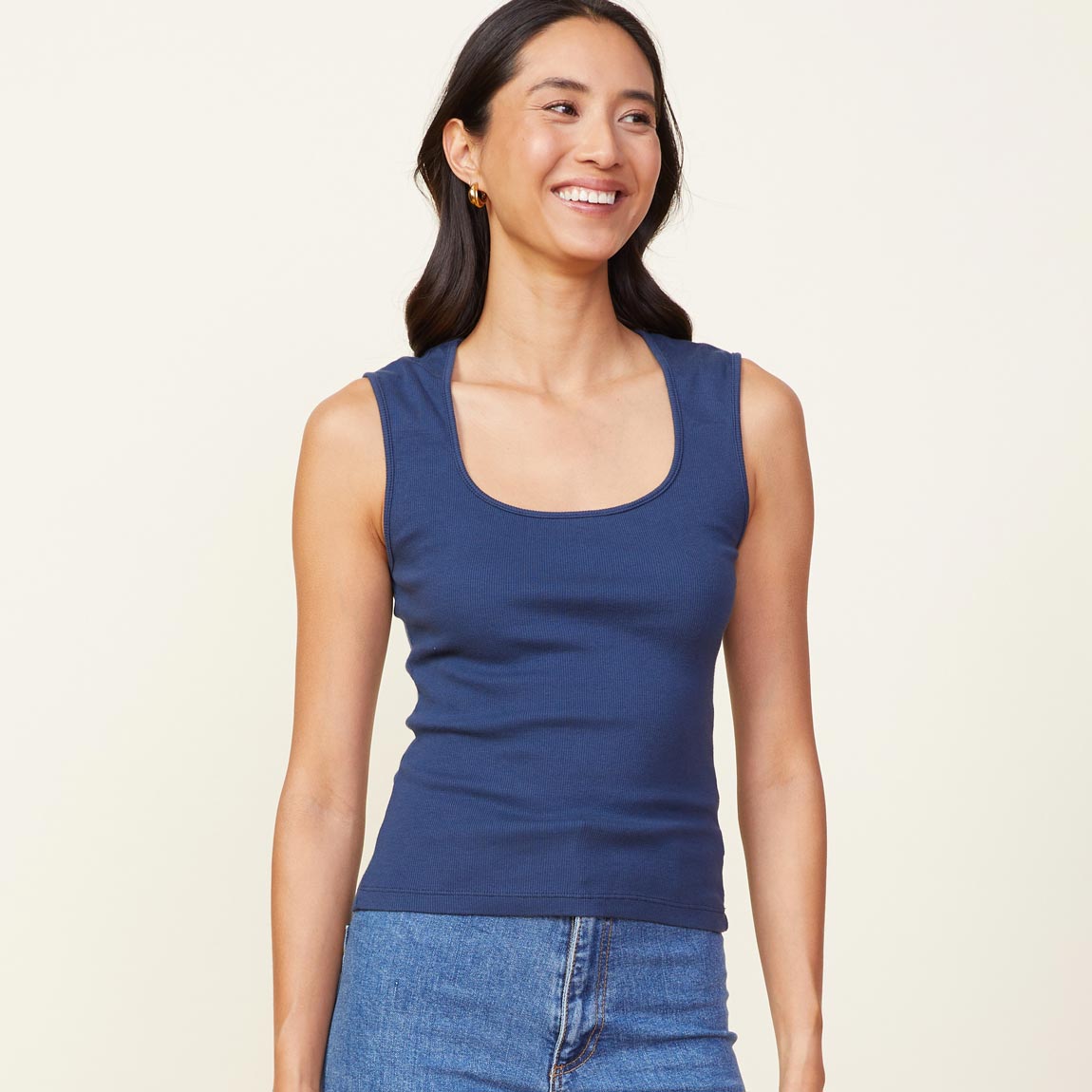Front view of model wearing the 90's rib tank in dark denim.