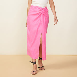 Front view of model wearing the linen sarong skirt in rose bud.