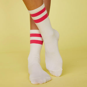 Front view of model's feet wearing the stripe socks in raspberry.