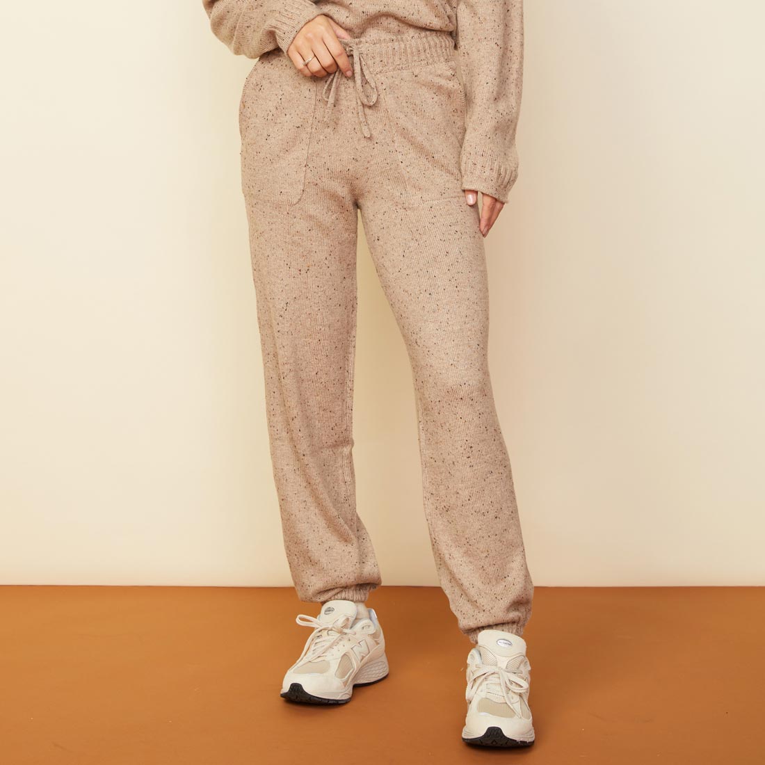 Front view of model wearing the neps vintage sweat in almond.