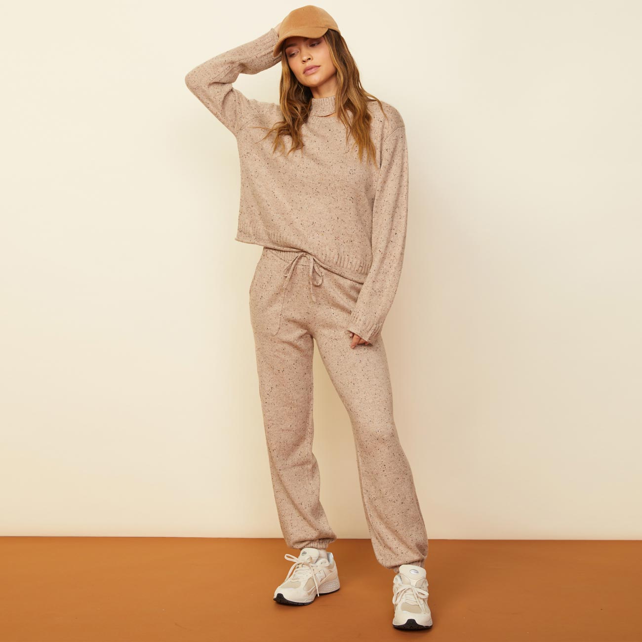 Front view of model wearing the neps vintage sweat in almond.