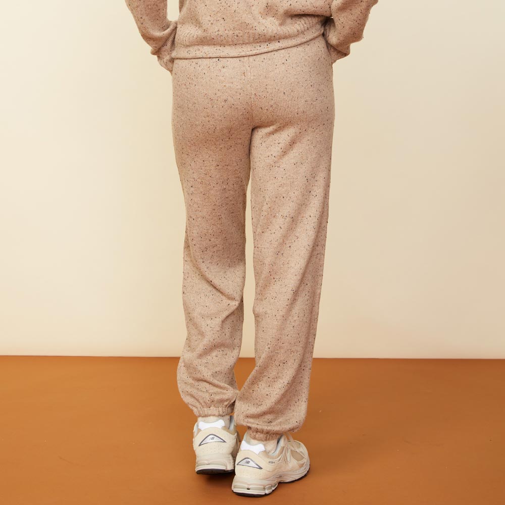 Back view of model wearing the neps vintage sweat in almond.