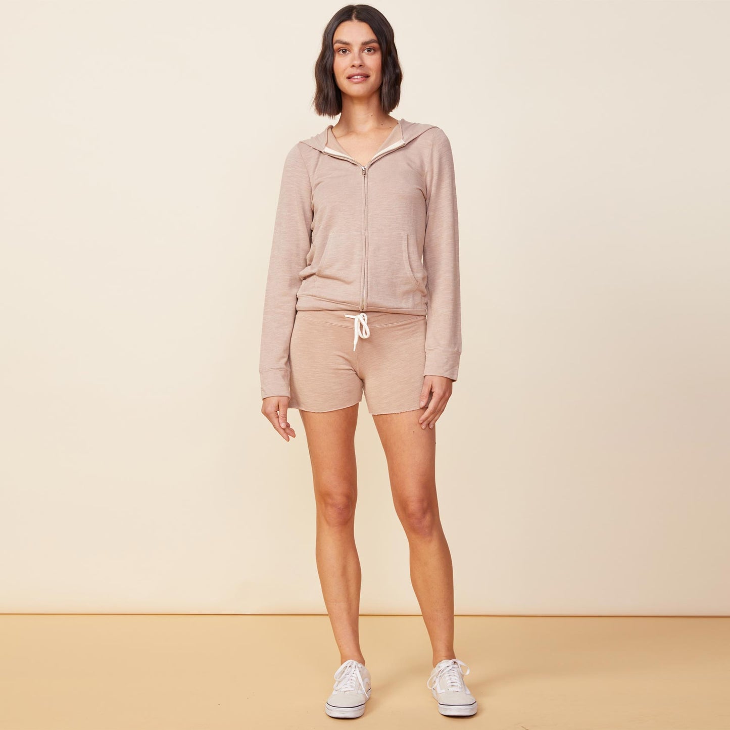 Front view of model wearing the supersoft vintage shorts in taupe.