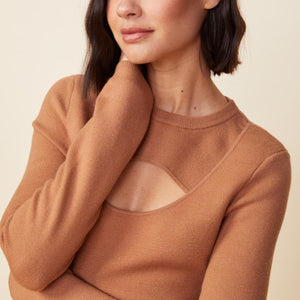 Detail view of model wearing the supersoft sweater knit cut out dress in doe.