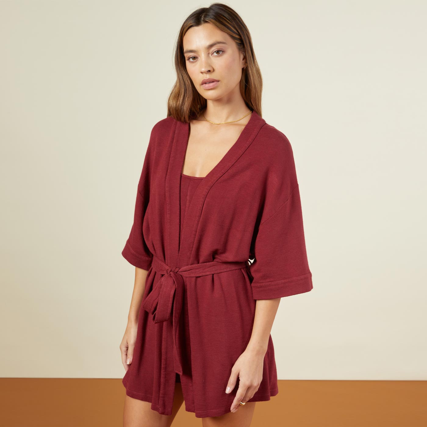 Side view of model wearing the supersoft robe in rhubarb.