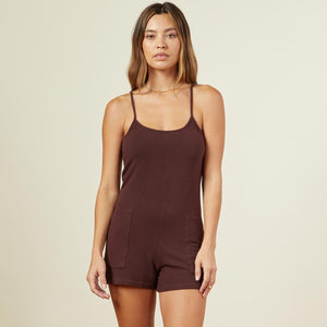 Front view of model wearing the supersoft easy romper in dark oak.