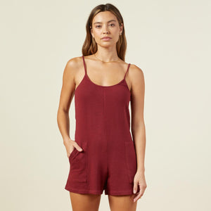Front view of model wearing the supersoft easy romper in rhubarb.