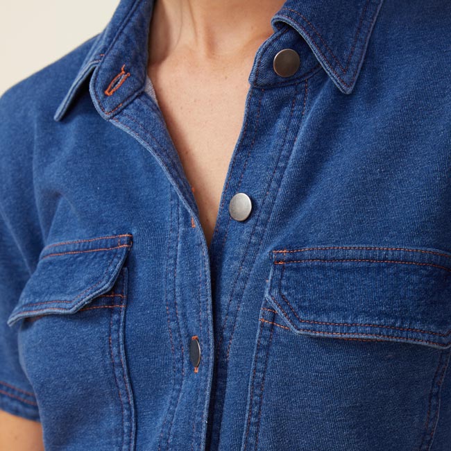 Close up view of model wearing the indigo french terry jumpsuit in indigo.