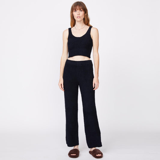 Front view of model wearing the plush sweater tank in black.