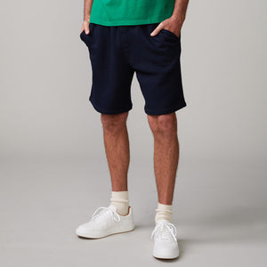Front view of model wearing the 70's shorts in indigo.