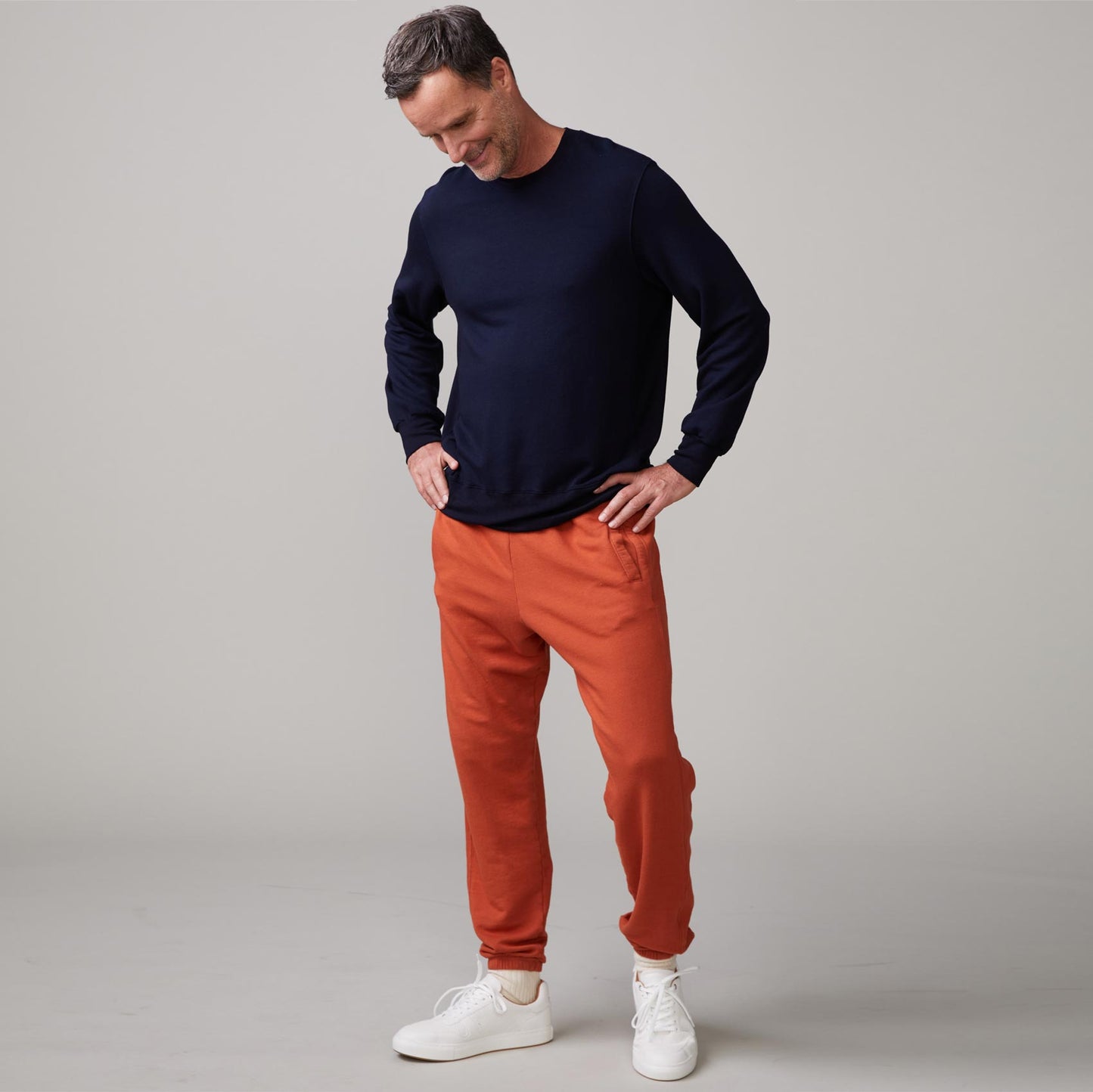 Front view of model wearing the lounge sweatshirt in inca.