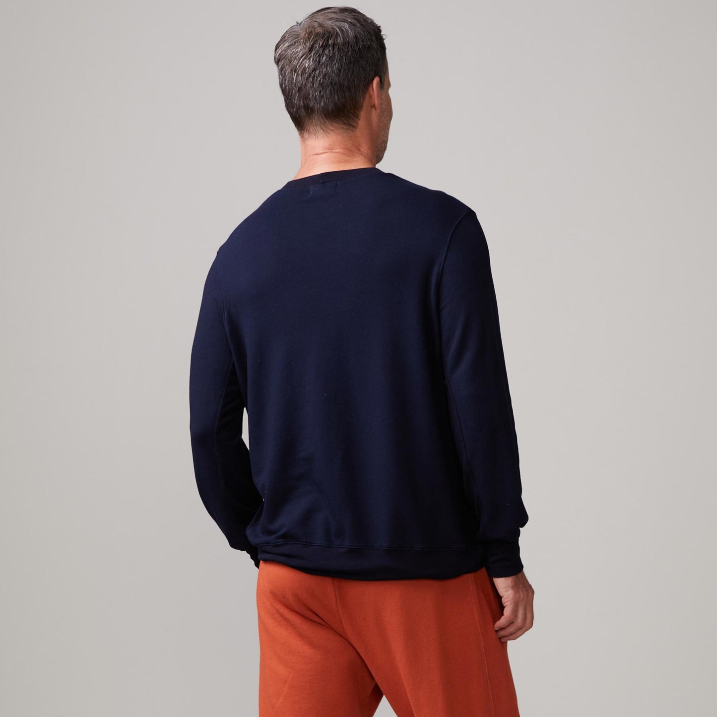 Back view of model wearing the lounge sweatshirt in inca.