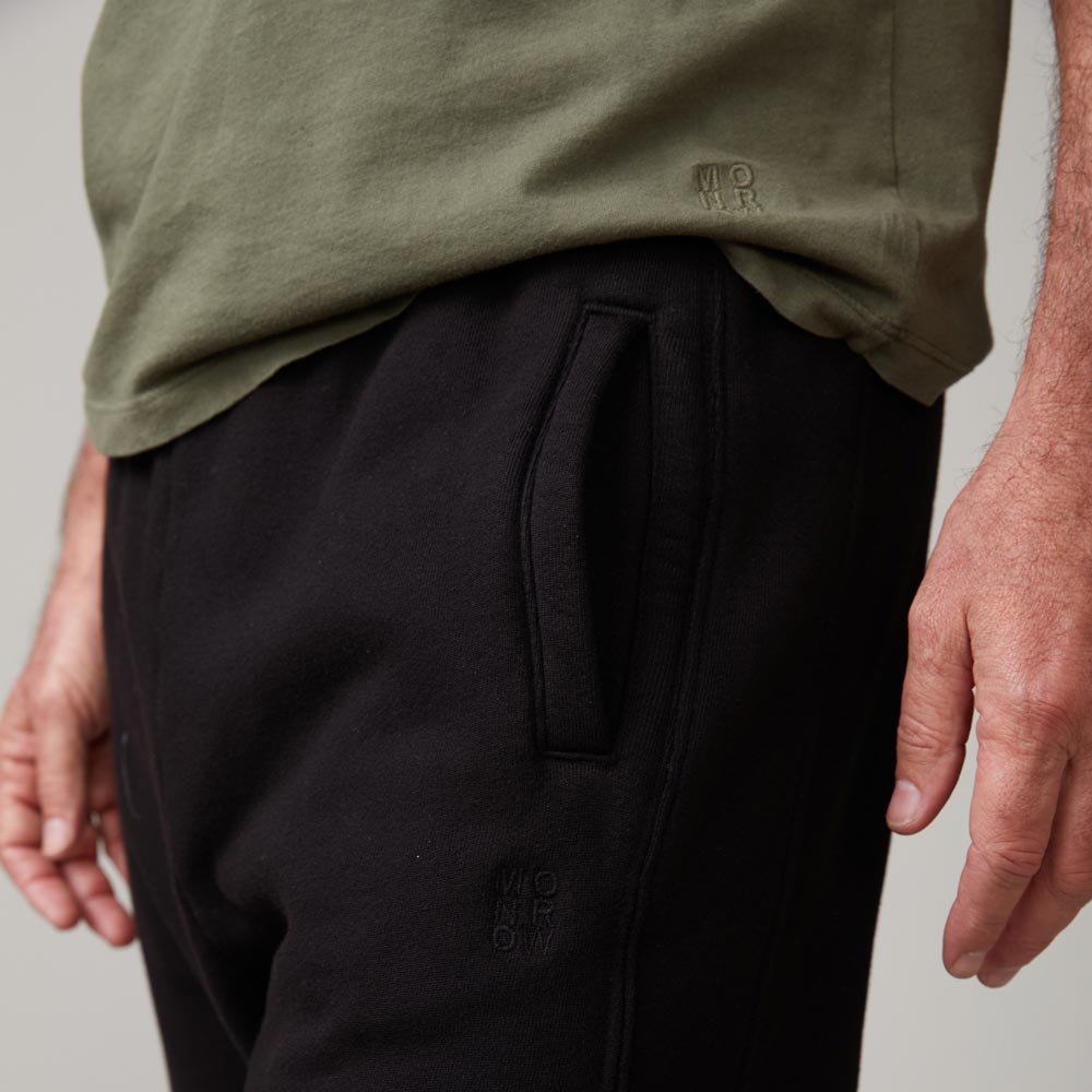 Close up of embroidered detail on the relaxed crew in general green.