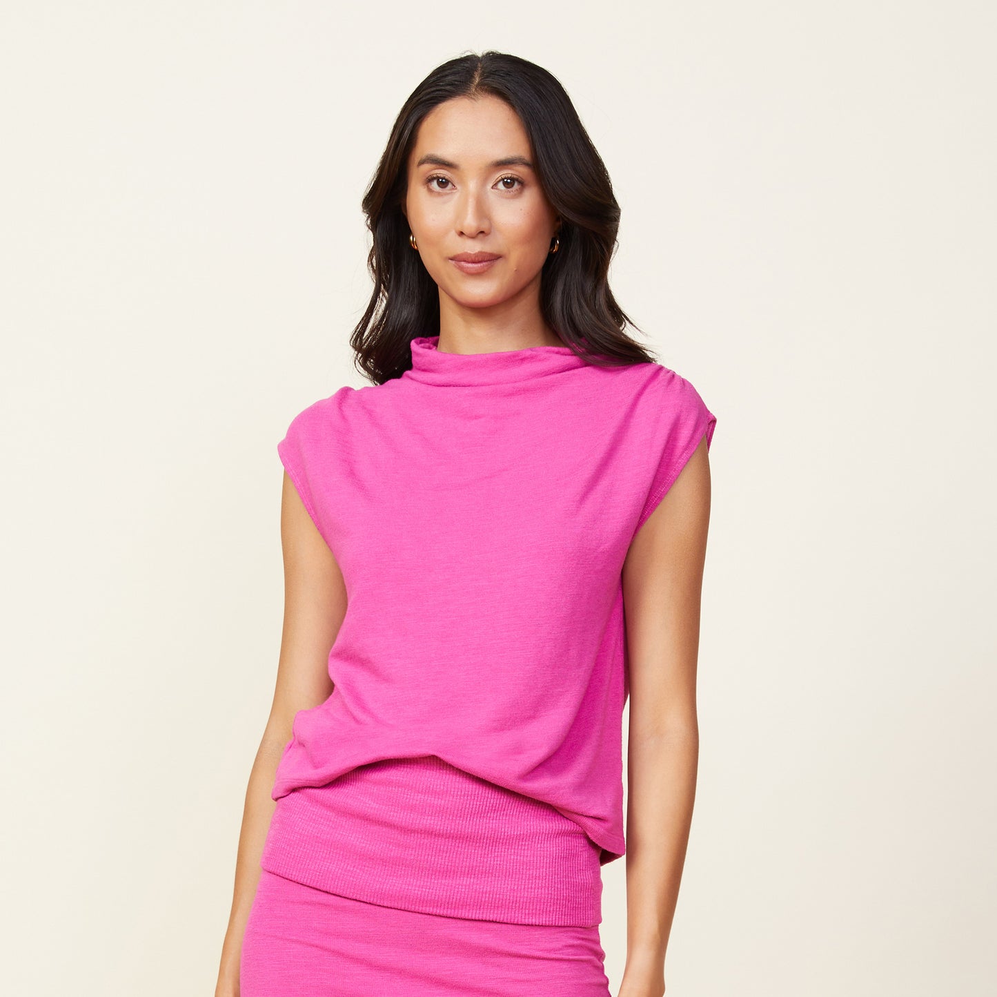 Front view of model wearing the supersoft shirred shoulder top in raspberry rose.