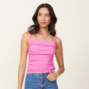 Front view of model wearing the rib shirred tank in raspberry rose.