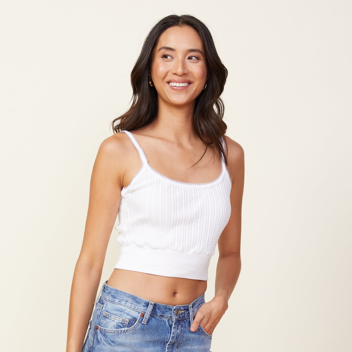 Front view of model wearing the cable rib mini tank in white.
