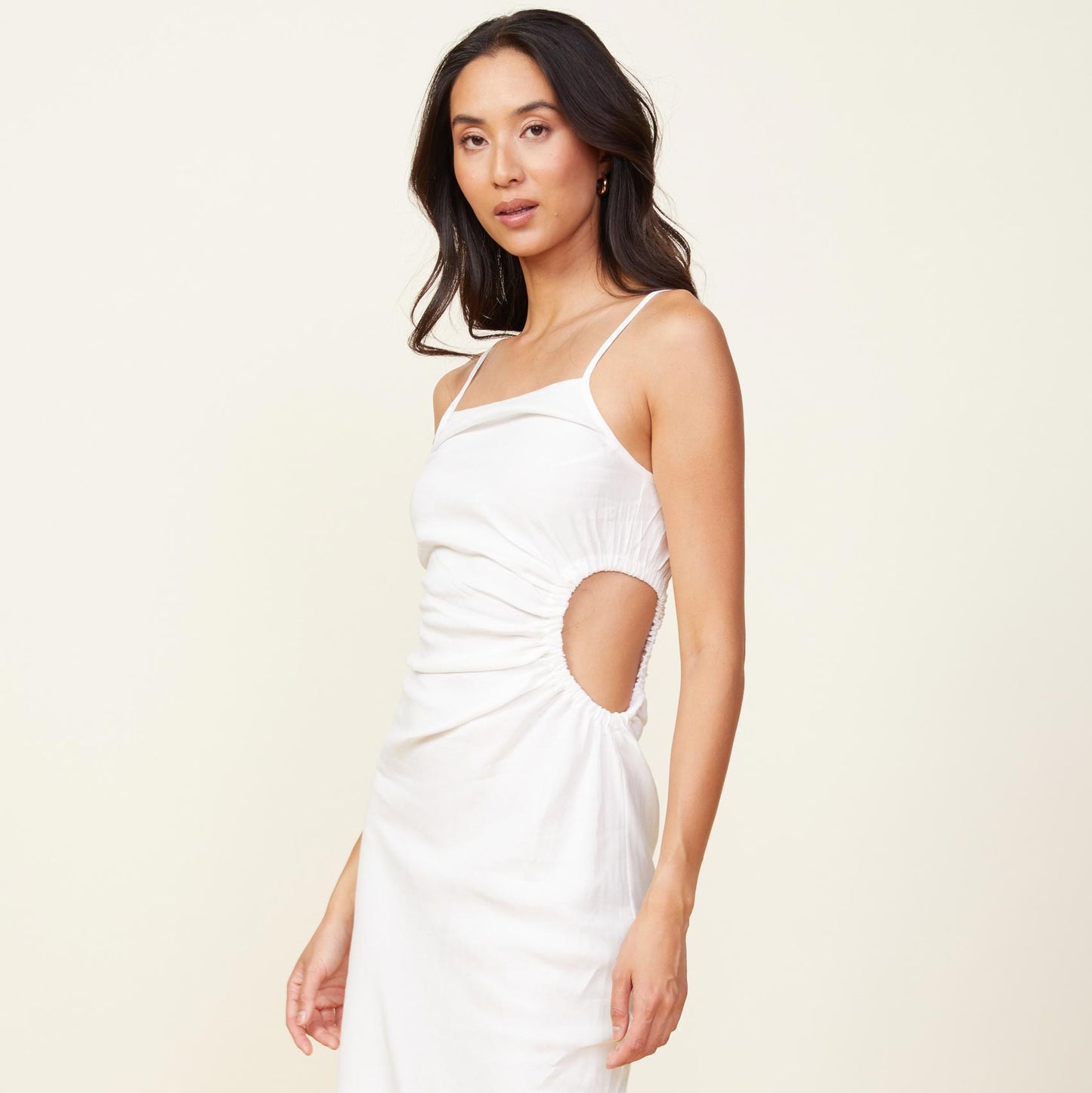 Front view of model wearing the linen slip dress in white.