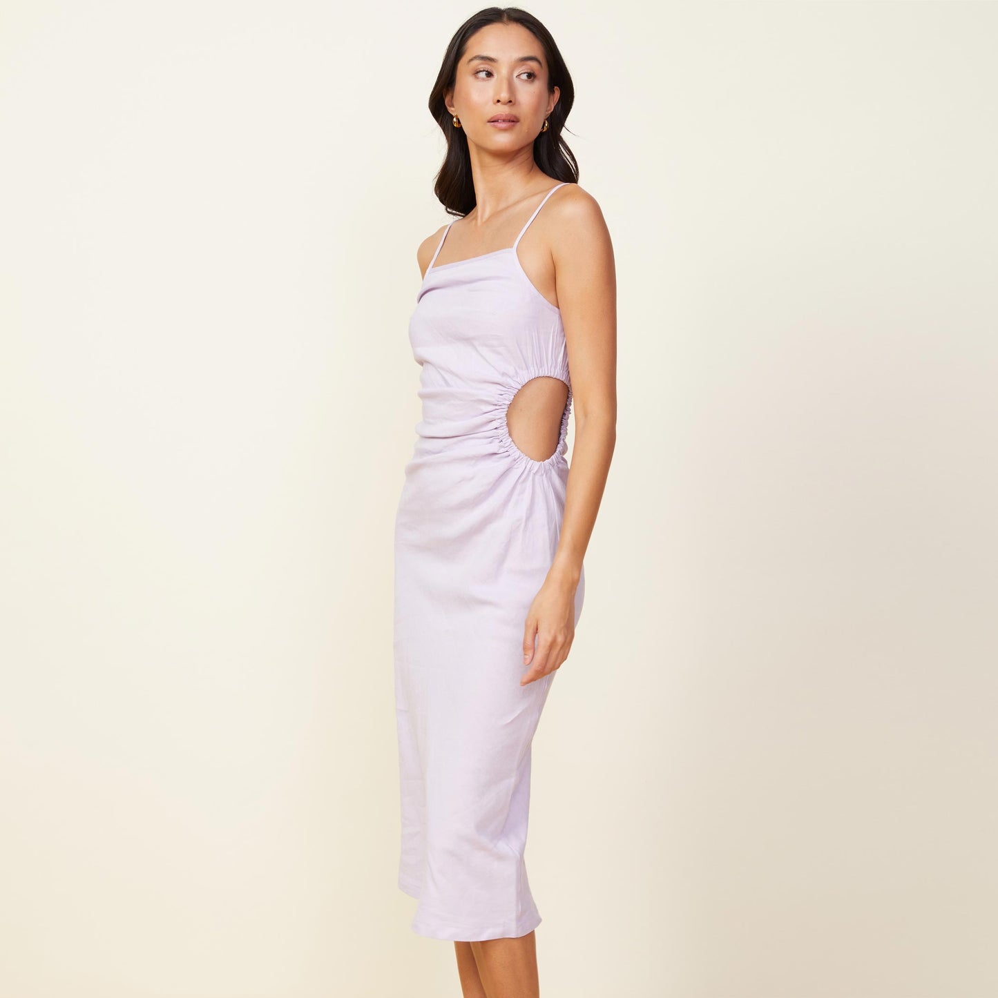 Side view of model wearing the linen slip dress in wisteria.