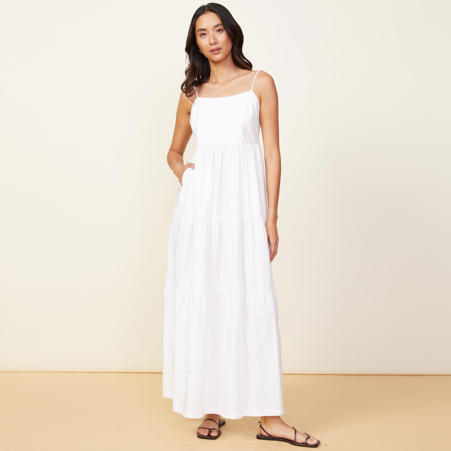 Front view of model wearing the poplin maxi dress in white.