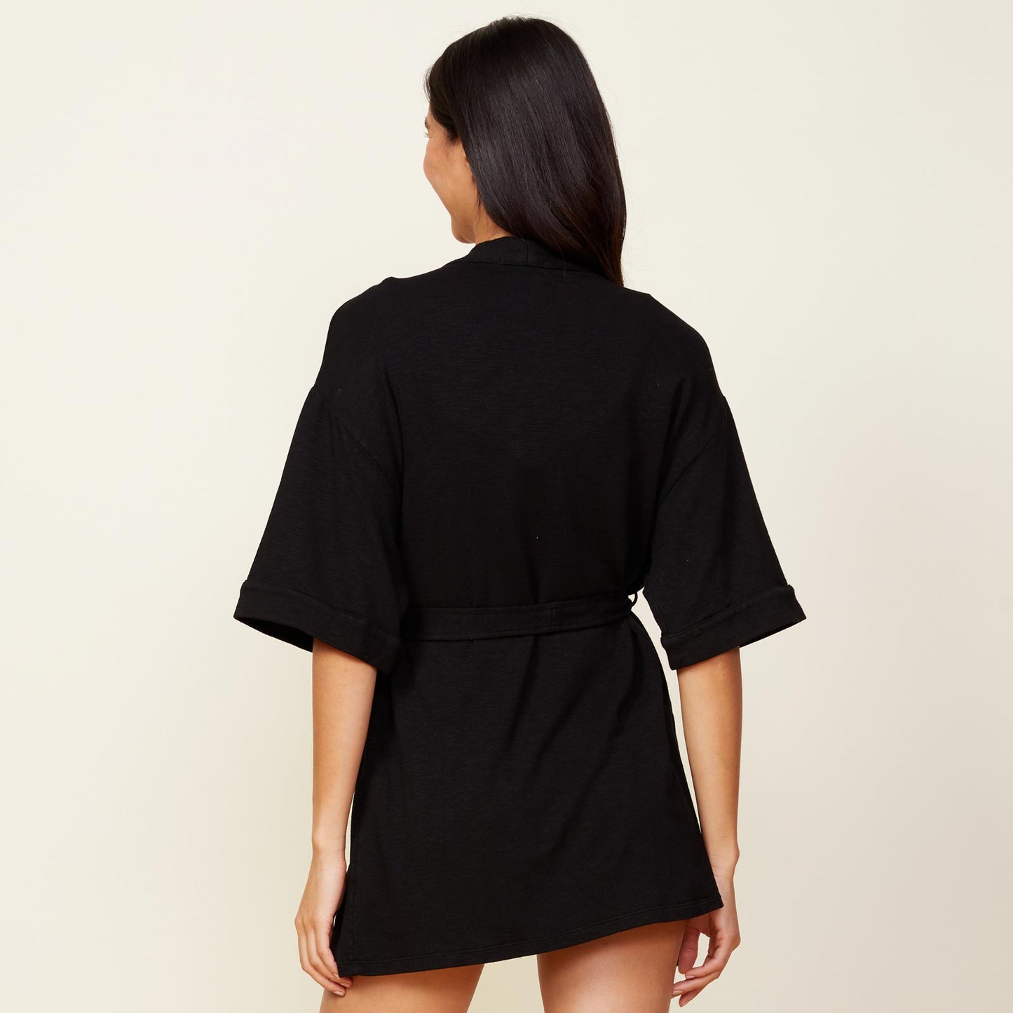 Back view of model wearing the supersoft robe in black.