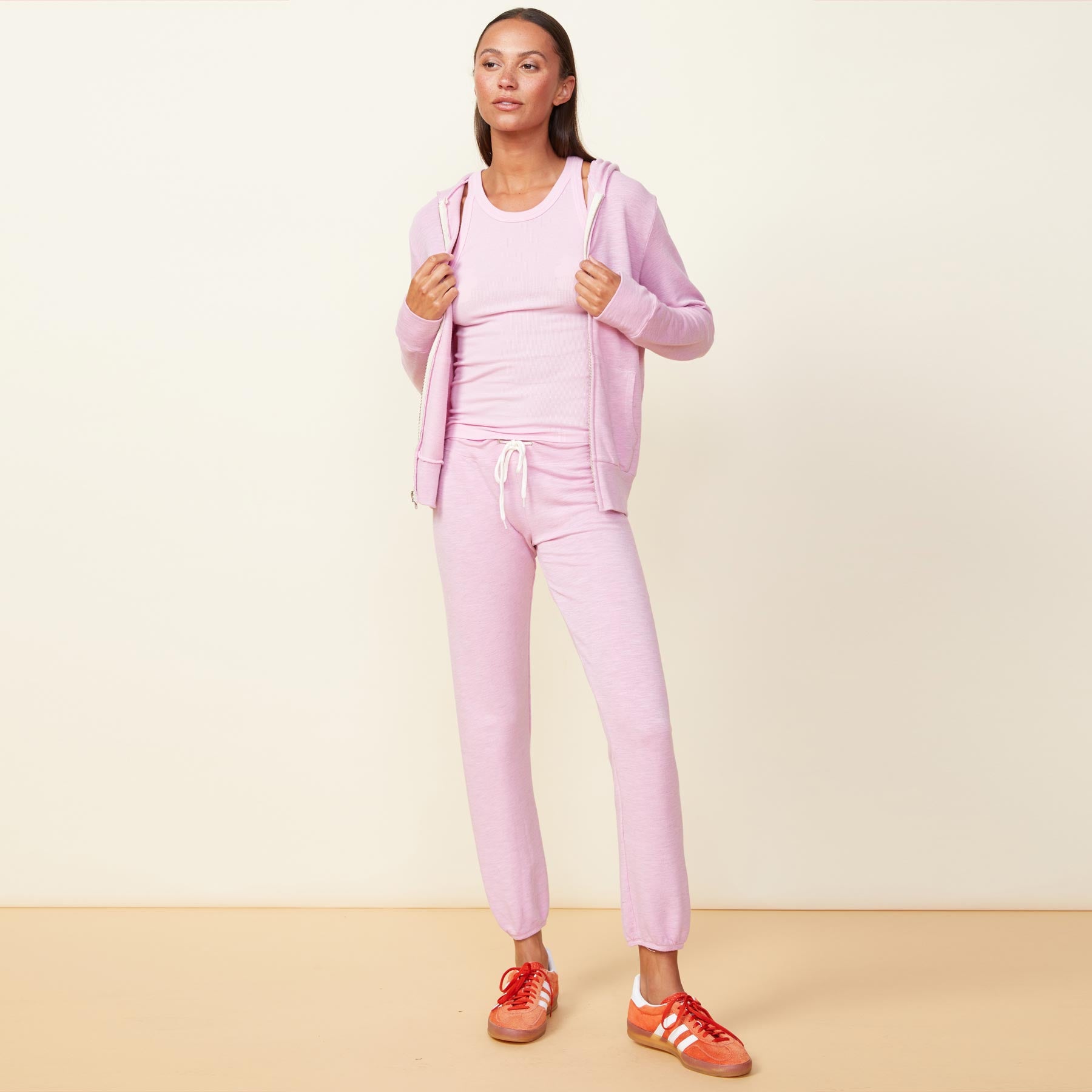 Front view of model wearing the supersoft zip up hoody in pink lavender.