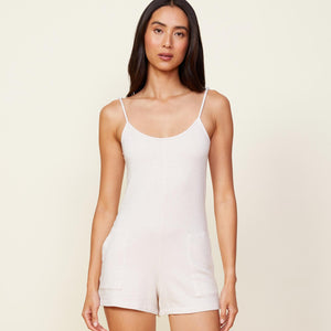 Front view of model wearing the supersoft easy romper in bone.