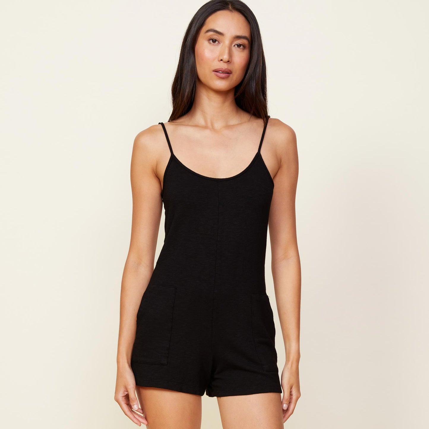 Front view of model wearing the supersoft easy romper in black.
