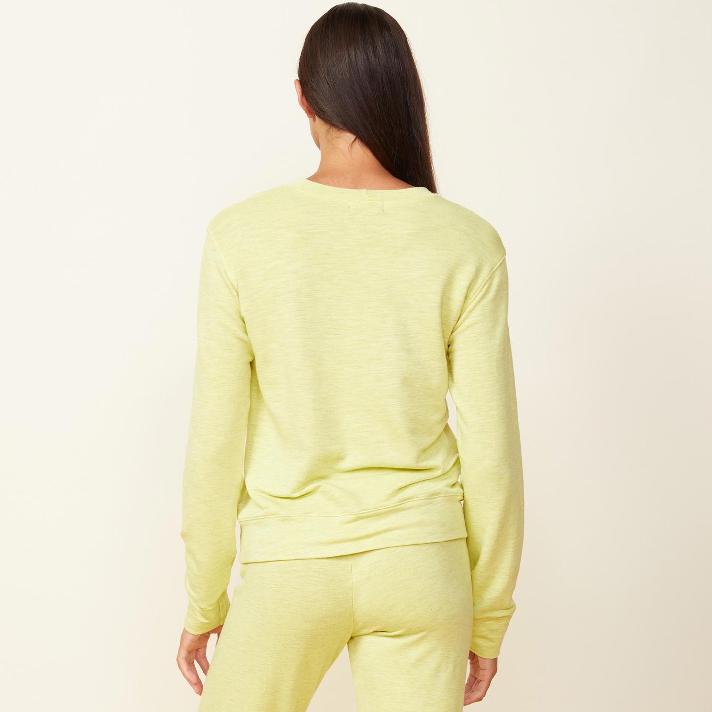 Back view of model wearing the supersoft crew neck sweatshirt in citron.