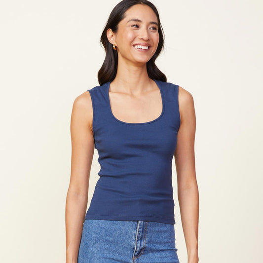 Front view of model wearing the 90's rib tank in dark denim.