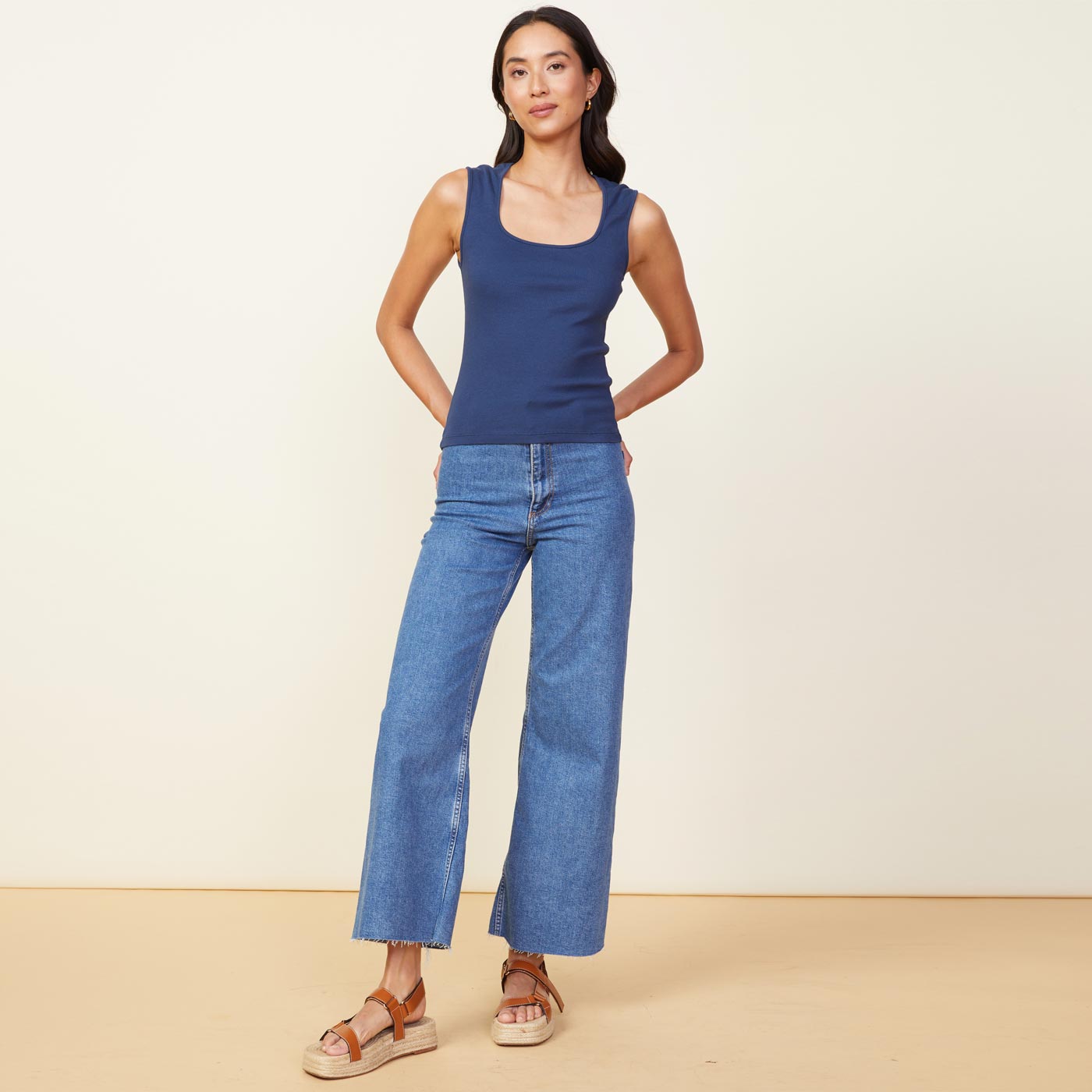 Front view of model wearing the 90's rib tank in dark denim.