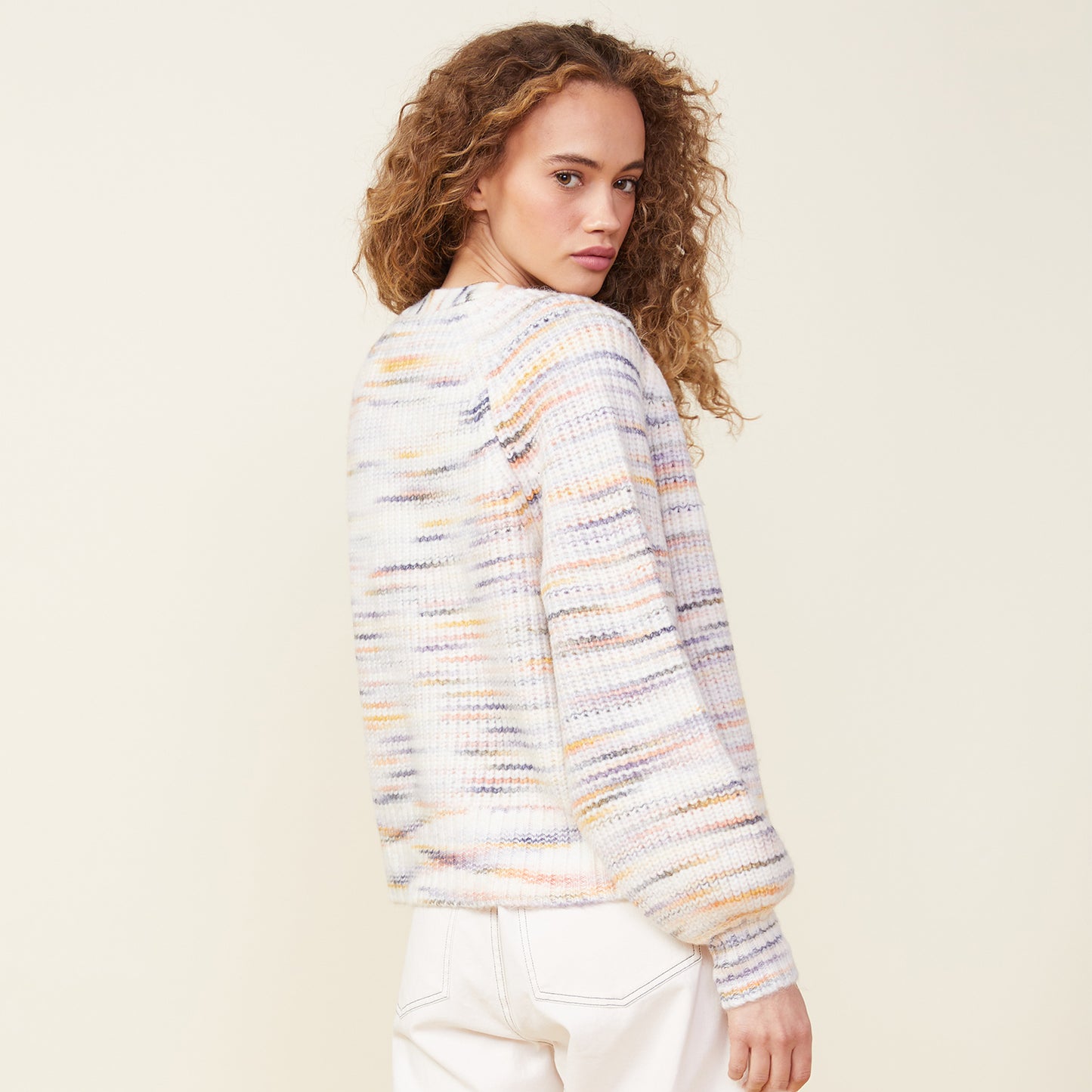 Back view of model wearing the space dye sweater cardigan in fruity pebbles.