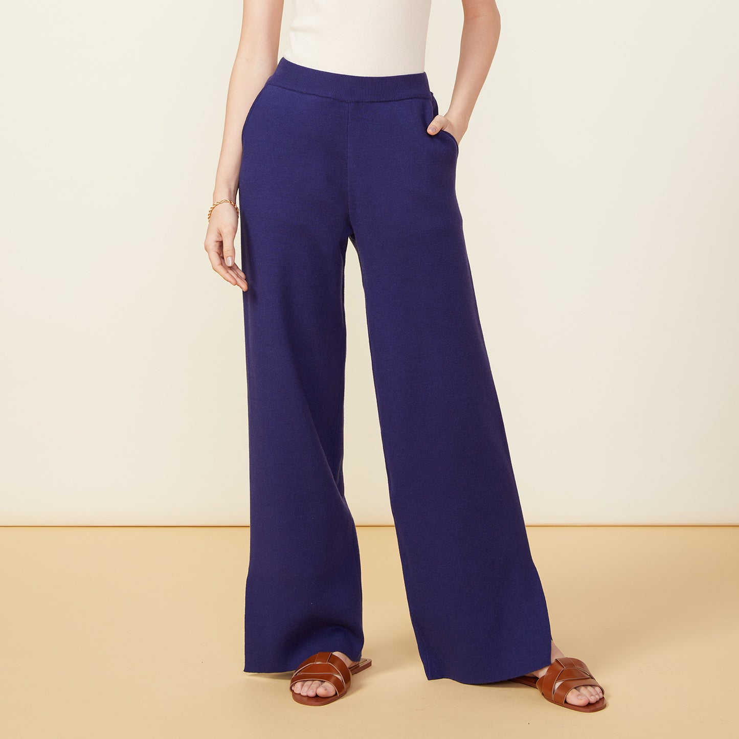 Front view of model wearing the supersoft sweater knit slit pants in navy.