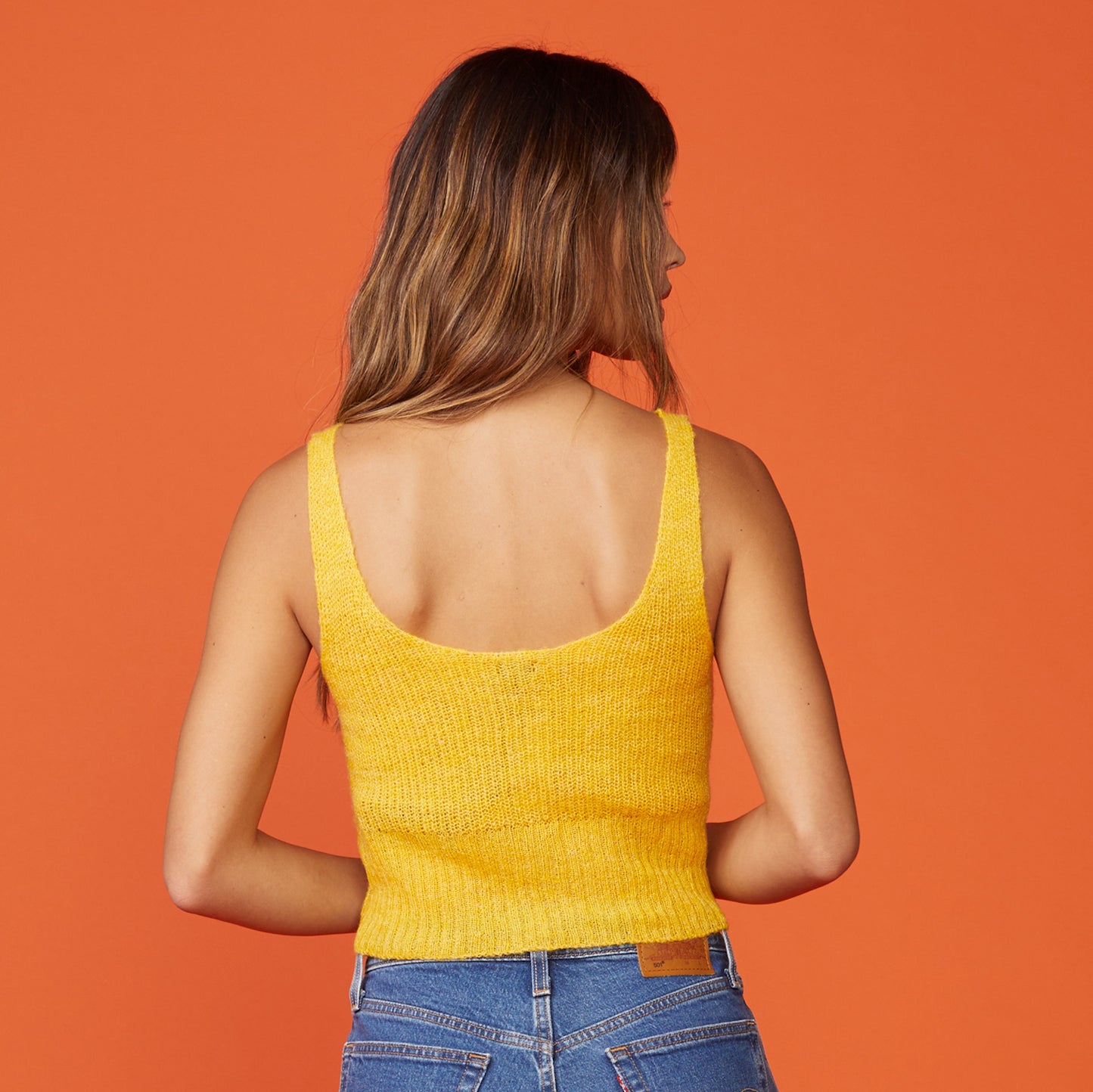 Back view of model wearing the mohair tank in sunshine.