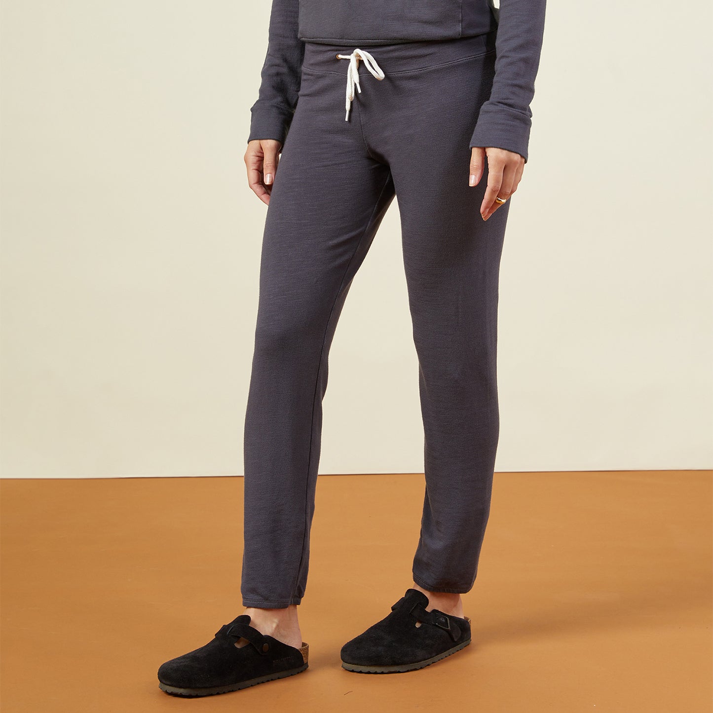 Side view of model wearing the supersoft vintage sweats in vintage black.