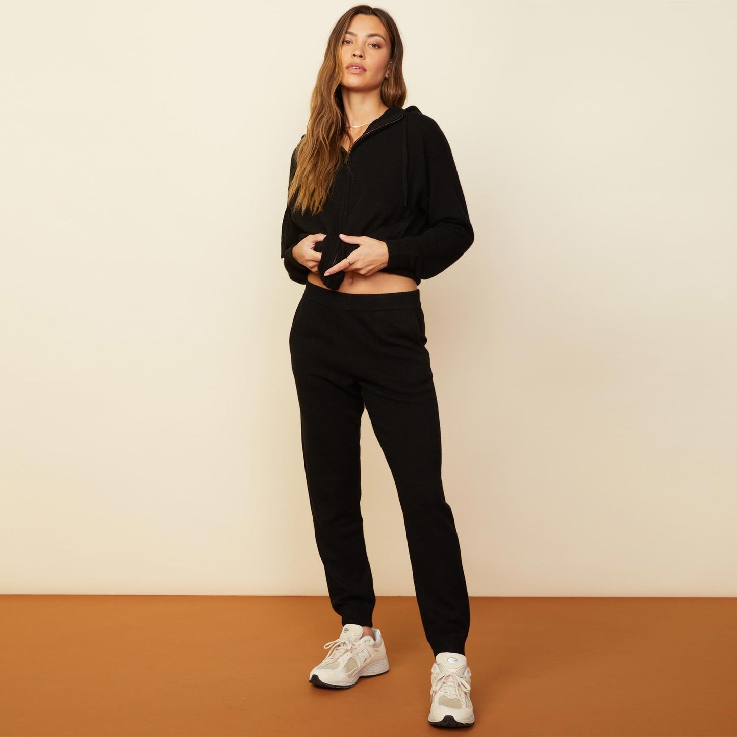 Front view of model wearing the cashmere jogger in black.