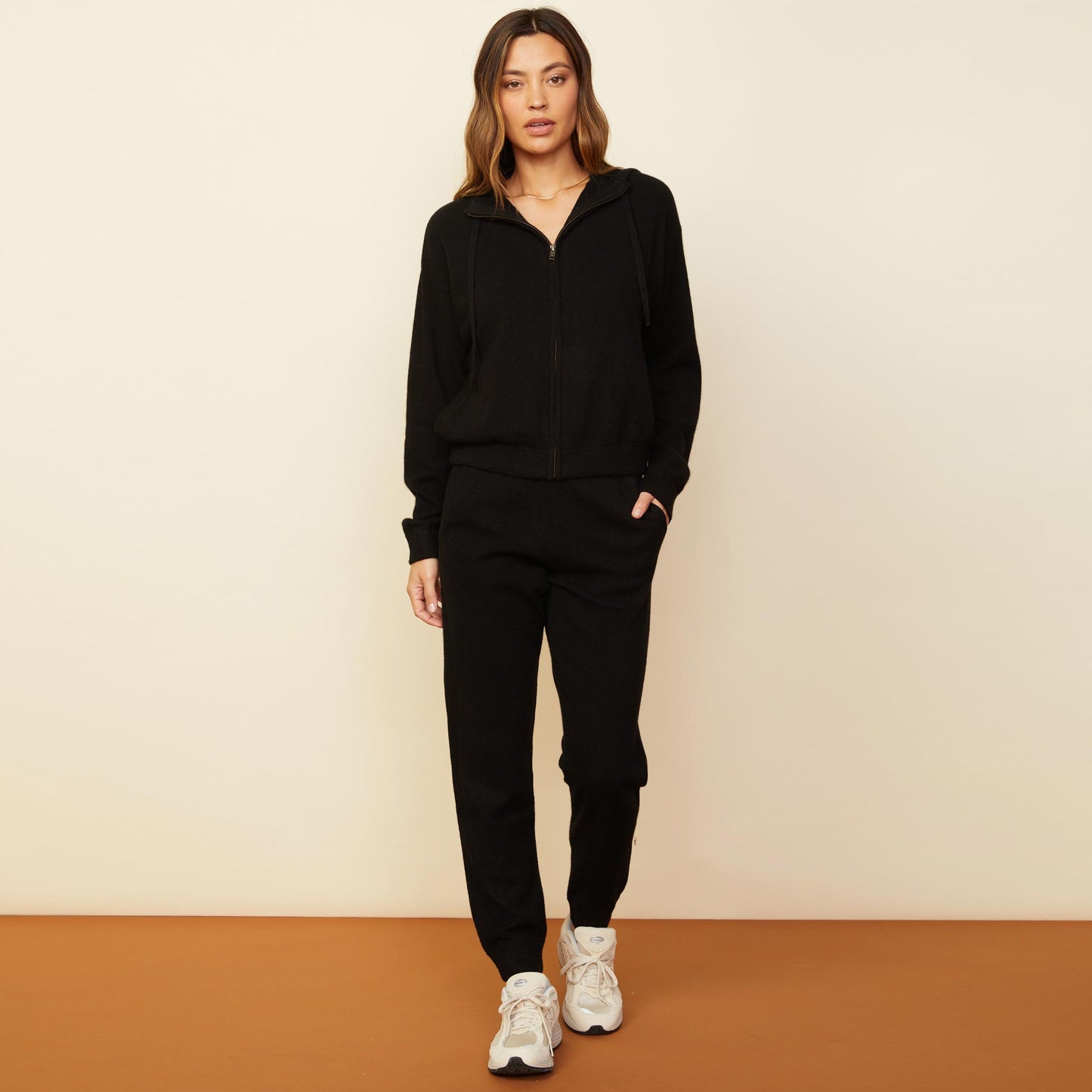 Front view of model wearing the cashmere jogger in black.