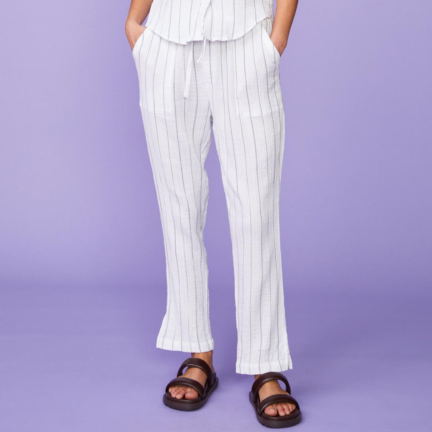 Front View of model wearing the Pinstripe Gauze Pants in White