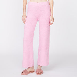 Front view of model wearing the plush sweater pants in orchid.