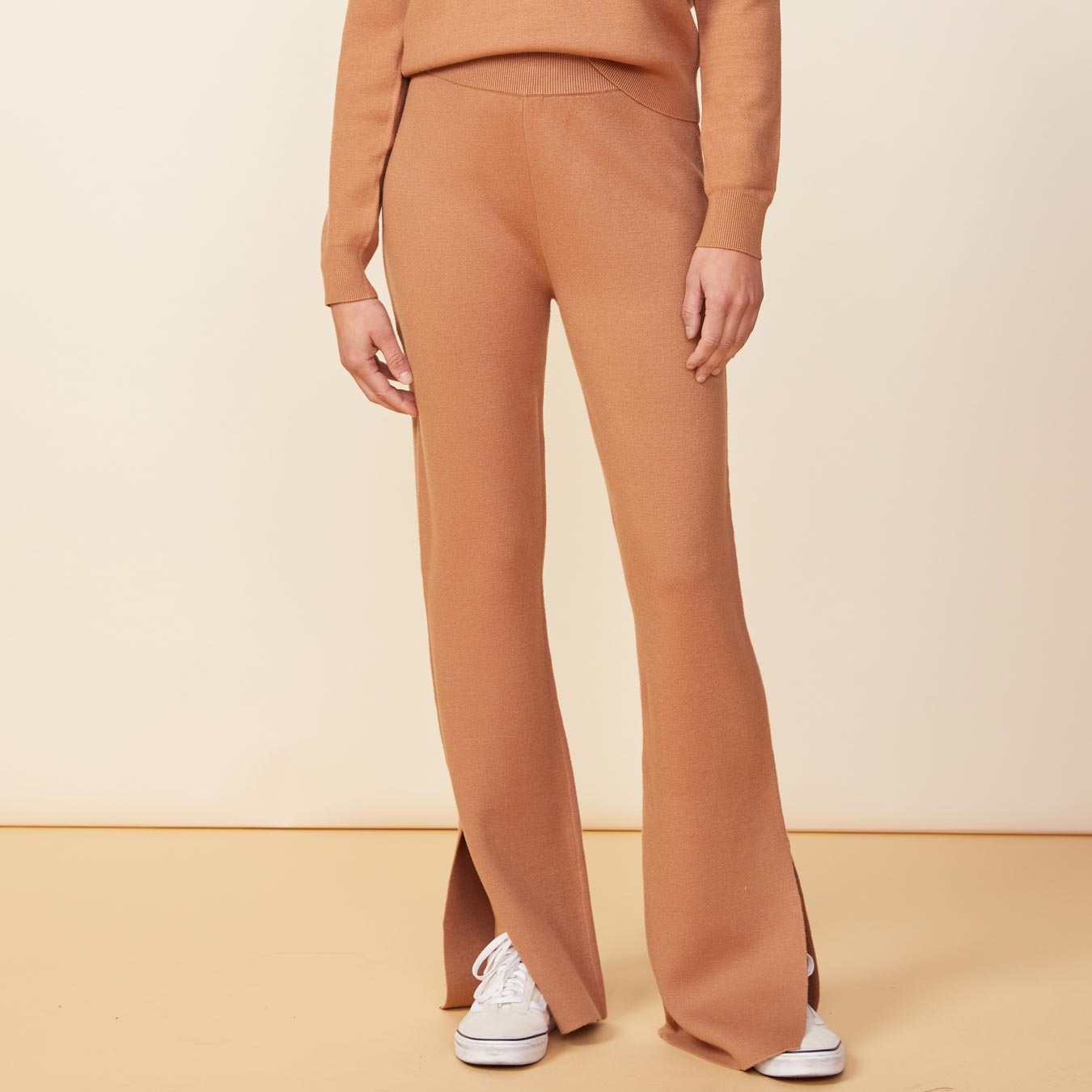 Front view of model wearing the supersoft sweater knit flare pants in doe.