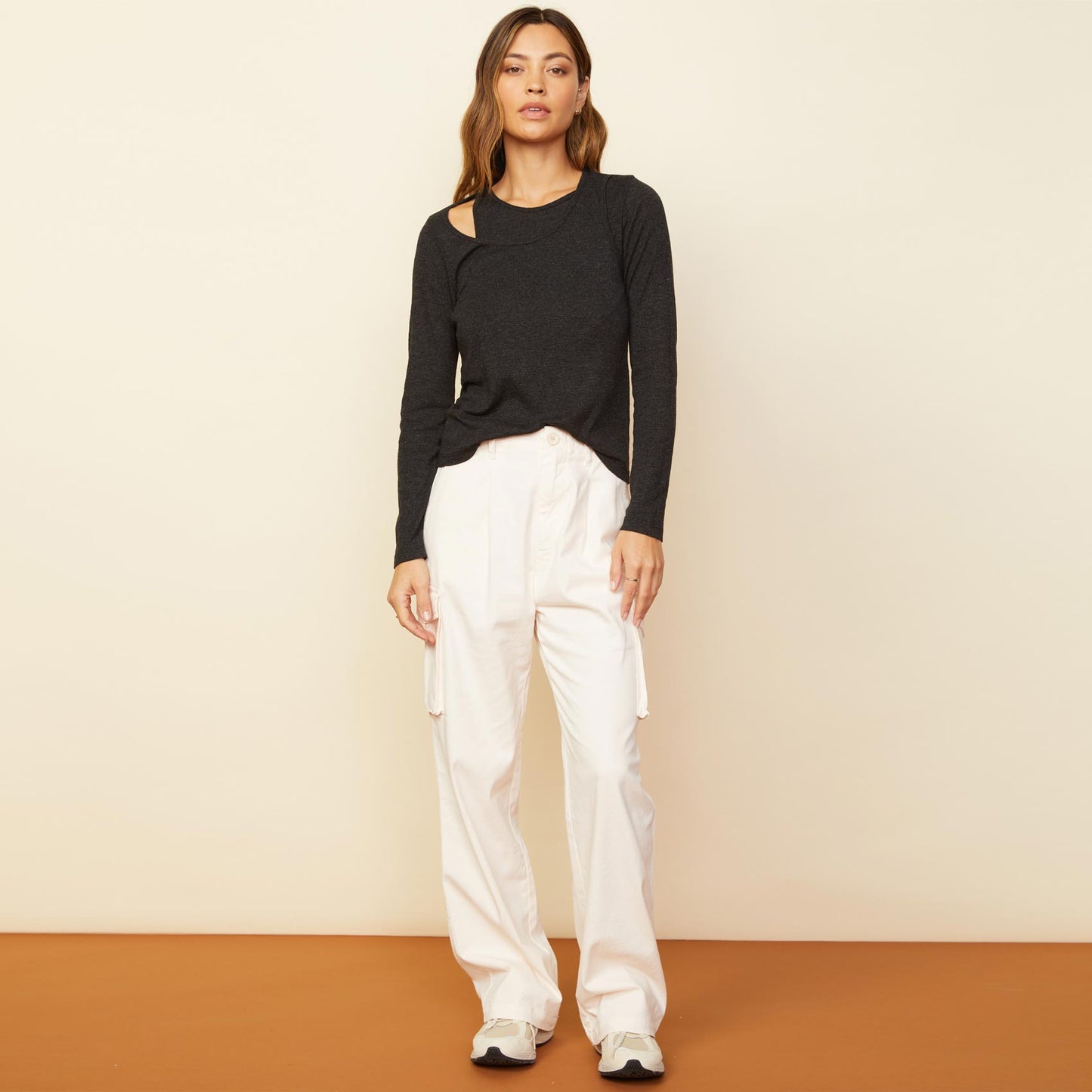 Front view of model wearing the utility wide leg pants in off white.