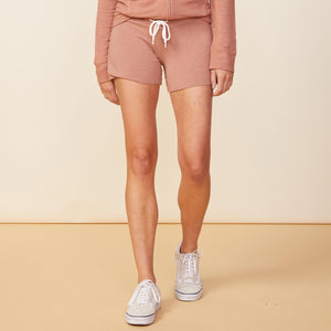 Front view of model wearing the supersoft vintage shorts in dry rose.
